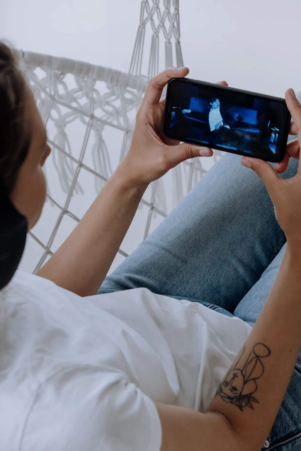 A viewer watching a video on a phone.